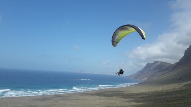 Landing on the beach with the paraglider 