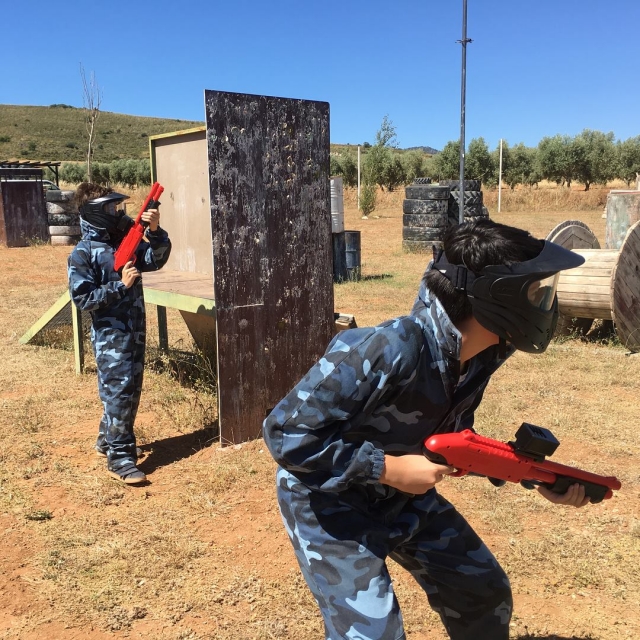  Crouching with the paintball markers 