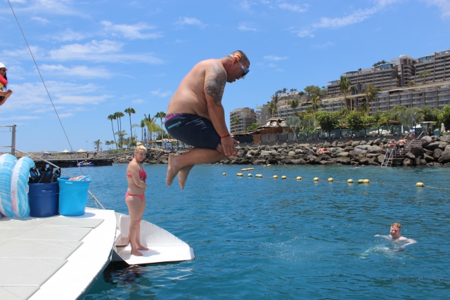  Jumping into the water from the catamaran 