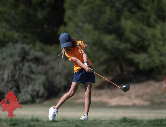  Young man playing golf at the camp 