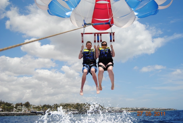  Flying through Playa Blanca in parasailing 