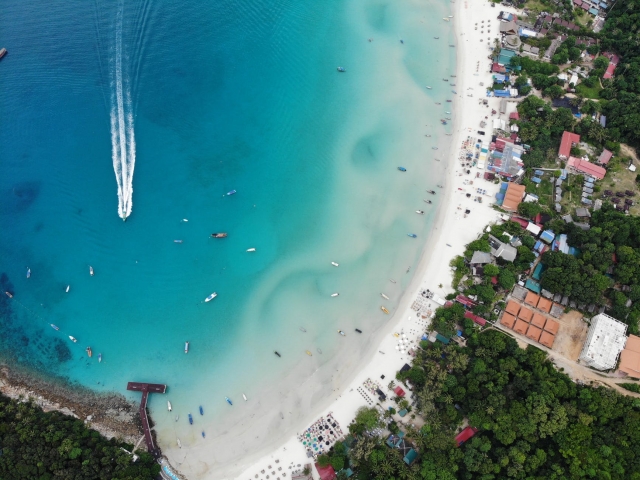  boat on coast from above 