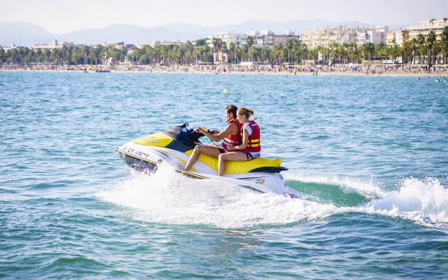  Man and woman riding together on jet ski