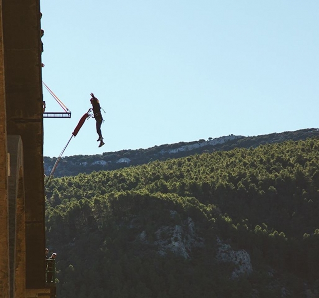  A user suspended in the air waving his arms 