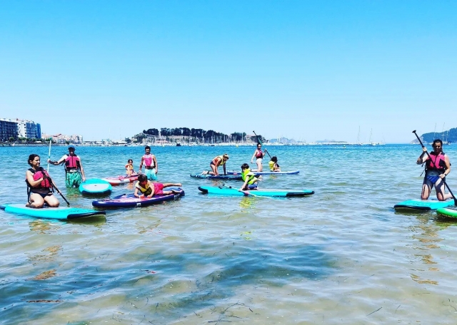  On the beach with paddle surf boards 