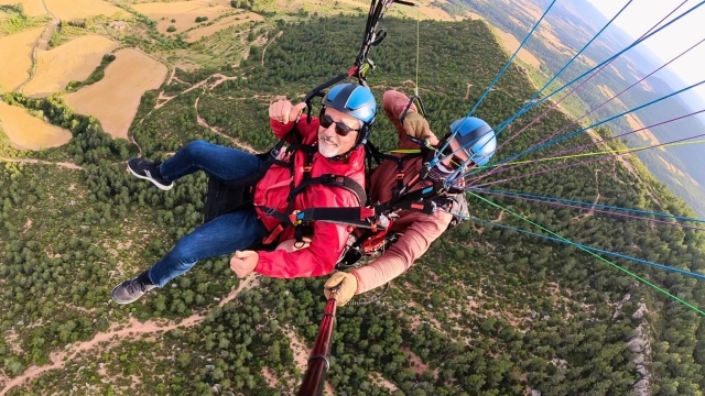 Parapente acrobático+pilotaje Serra de Rubiò 20min