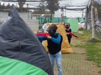 Children using special paintball guns