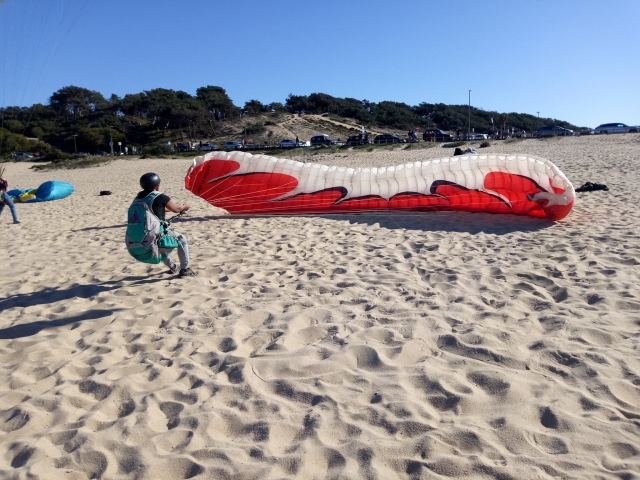  Trying to lift the tarp from the sand 