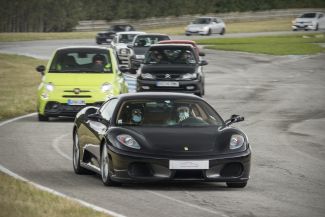  An army of cars led by a Ferrari 