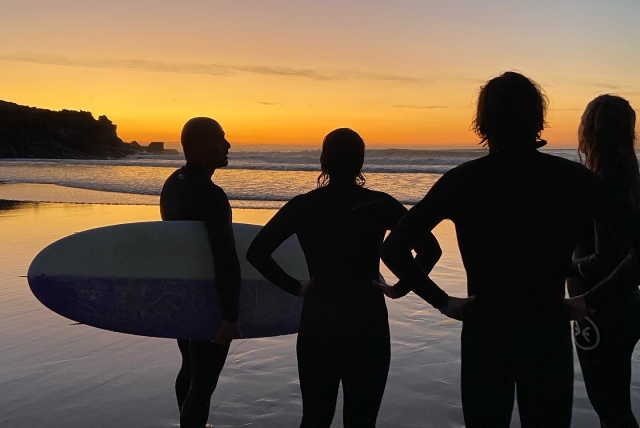  Surfers enjoying sunset 