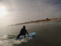 Learn how to stand up on the surfboard