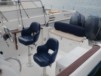 Seats next the rudder Key Largo 25