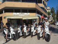  Group of friends with their scooters 