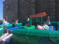 The children playing in the inflatable 