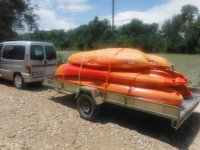  car carrying several canoes 