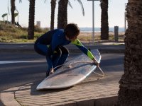  Lifting the board from the sidewalk 