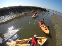  Sitting in individual kayaks 